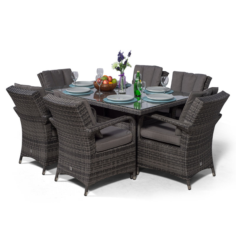 Karas 6 - Person Wicker Patio Dining Set with Rectangular Table , Cushions Included