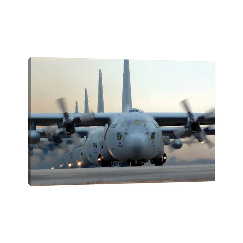 C-130 Hercules Aircraft Taxi Out For A Mission During A Six-Ship Sortie by Stocktrek Images - Wrapped Canvas Print