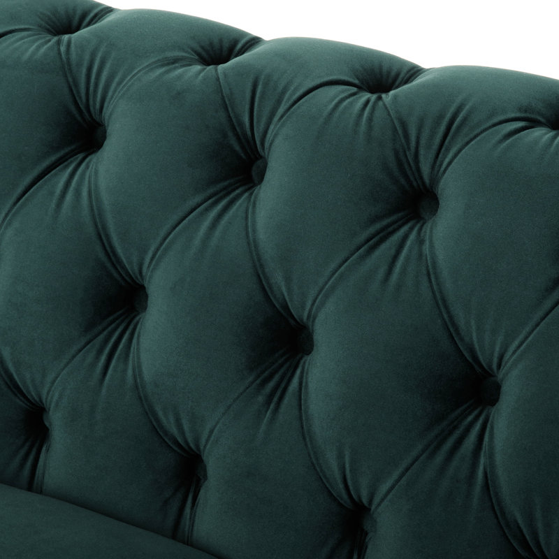 Luxueux canapé-lit rembourré en velours avec bouton capitonné, parfait pour des conversations relaxantes et des séances de lecture confortables