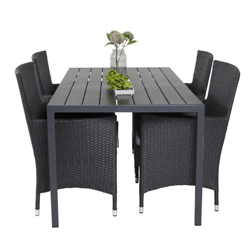 Hiran 4 - Person Patio Dining Set with Rectangular Table , Cushions Included, Black
