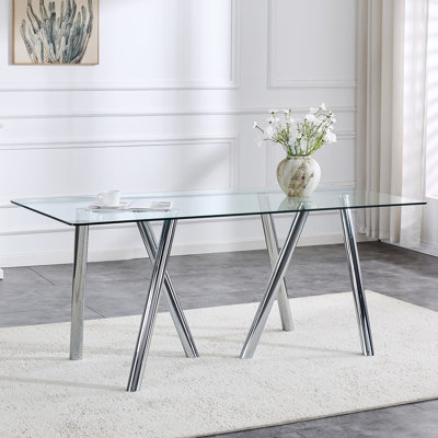 Table de salle à manger en verre trempé avec pieds robustes en métal