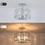 Plafonnier semi-encastré à 3 lumières de 30 cm de large avec cristaux, fini nickel poli et abat-jour cylindrique, idéal pour la chambre et le hall d'entrée.-2050769599