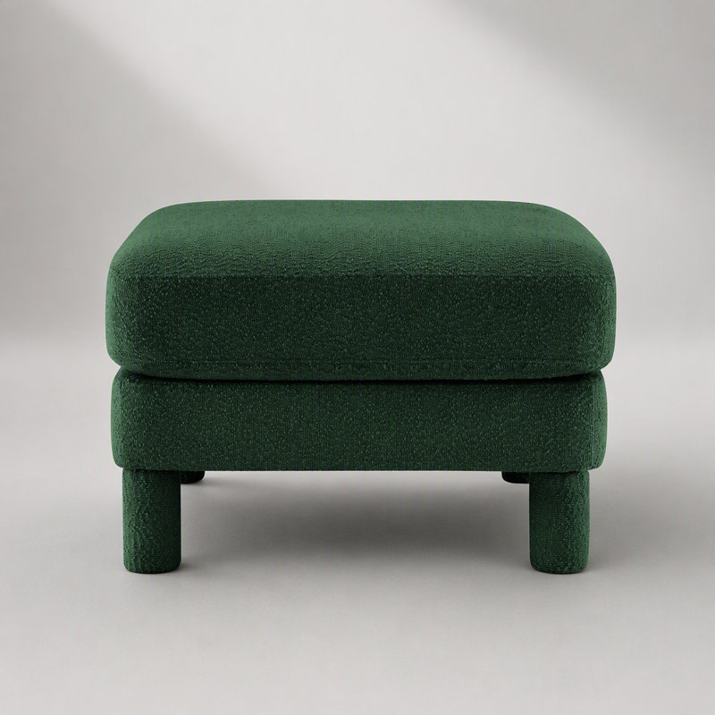 Pouf moderne en tissu bouclé avec accoudoirs incurvés et pieds cylindriques, idéal pour une assise élégante et confortable.