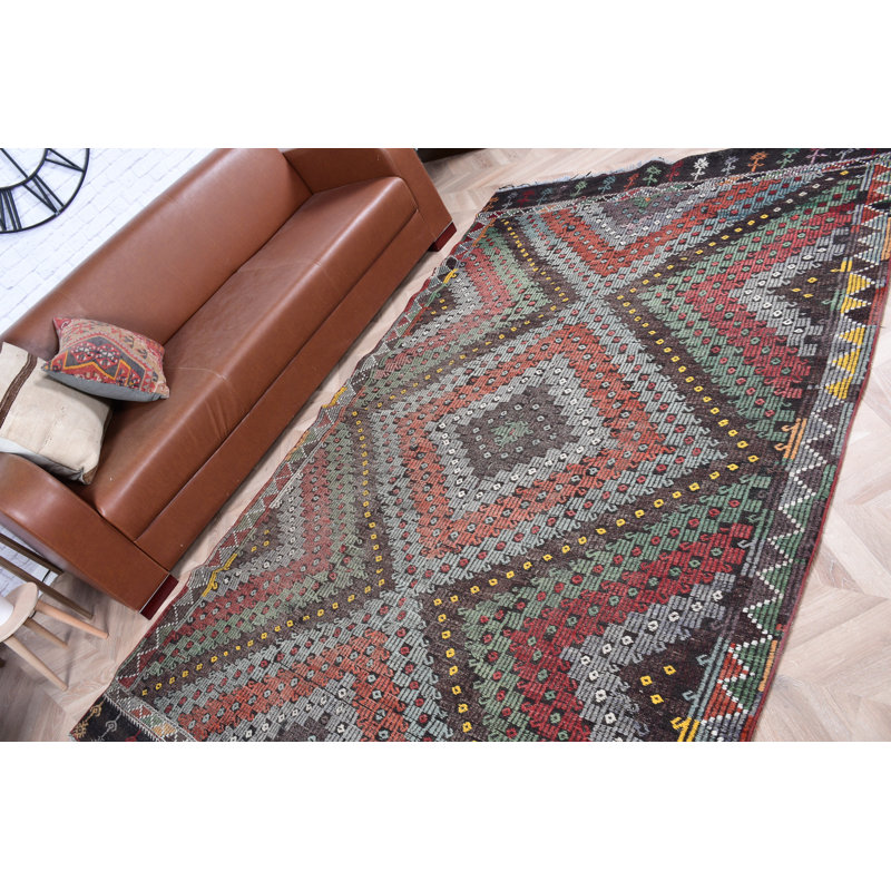 Tapis turc fabriqué à la main dans des tons de terre, idéal pour décorer un salon ou une chambre à coucher
