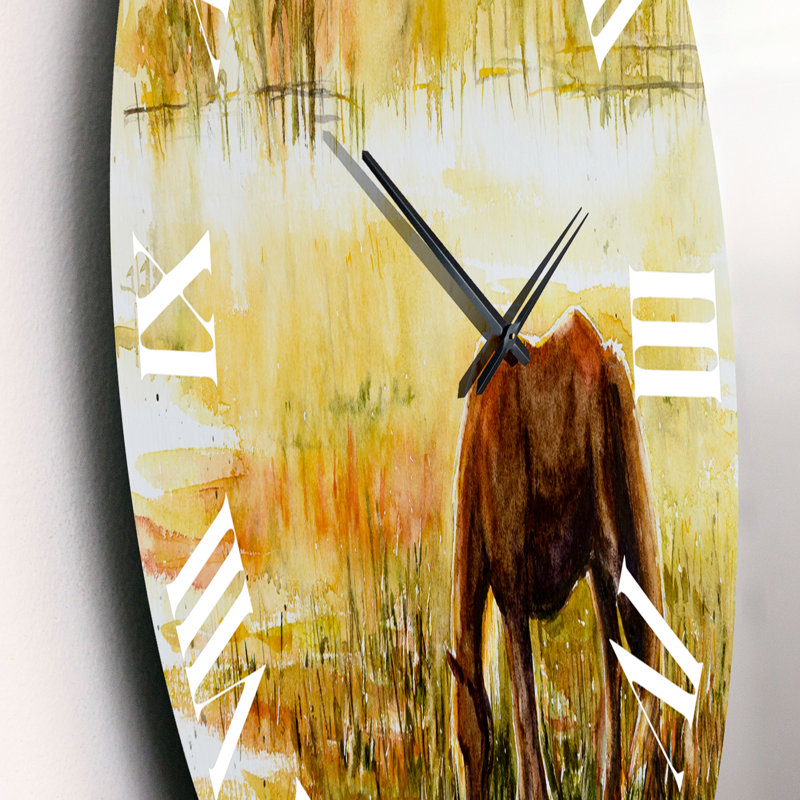 Cheval broutant sur un pré - horloge murale, Moyen