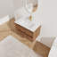 De meuble-lavabo mural avec lavabo en céramique et deux tiroirs à fermeture en douceur pour un rangement élégant et un design moderne