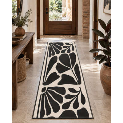 Motif tissé noir à motif floral moderne et tapis lavable