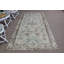 Tapis turc avec un élégant motif floral dans des tons pastel doux pour un décor de plancher élégant