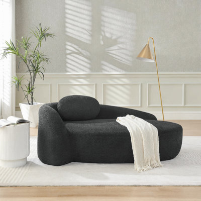 Fauteuil paresseux moderne simple ovale avec dossier intégré, accoudoirs latéraux et coussin, chaise longue compacte peu encombrante pour le salon - noir