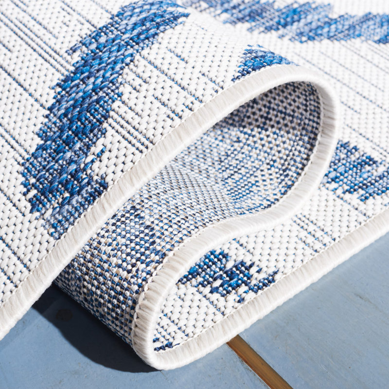 Ivory and Navy Animal Print Indoor/Outdoor Rug