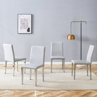 Quatre chaises de salle à manger en polyuréthane gris clair (seulement les chaises)