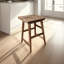 Tabouret à hauteur de comptoir sans dossier Tisa, siège de selle fabriqué à la main en bois d'acacia brun naturel-254910303