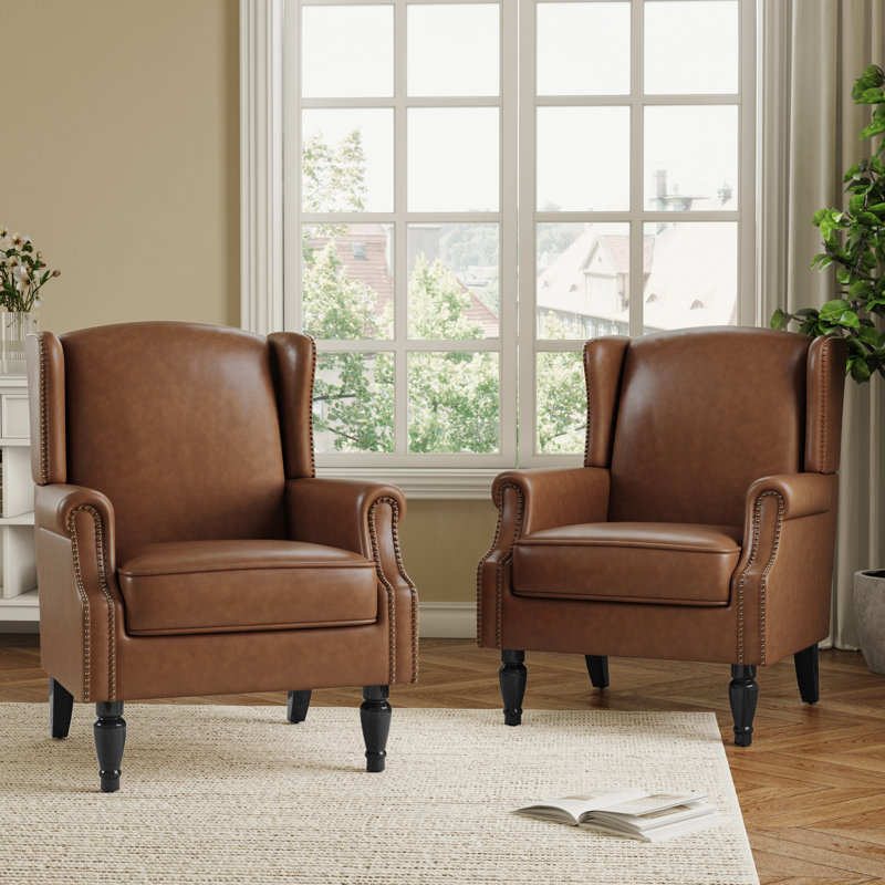 Fauteuil à oreilles en similicuir brun rembourré avec garniture cloutée Duward, Similicuir brun