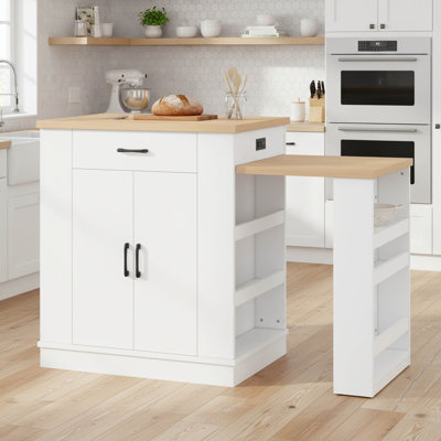 Îlot de cuisine extensible avec tiroirs, console mobile blanche avec armoire à double porte et tablettes ouvertes, servant de table de salle à manger et de bar à déjeuner