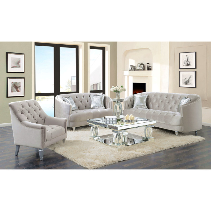 Causeuse grise grise contemporaine avec capitonnage