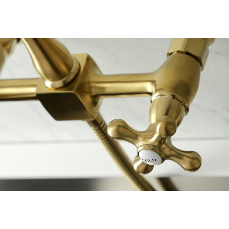 Kingston Brass Heritage Double-Handle 3-Hole Wall-Mount Bridge Kitchen Faucet with Brass Sprayer, Brushed Brass