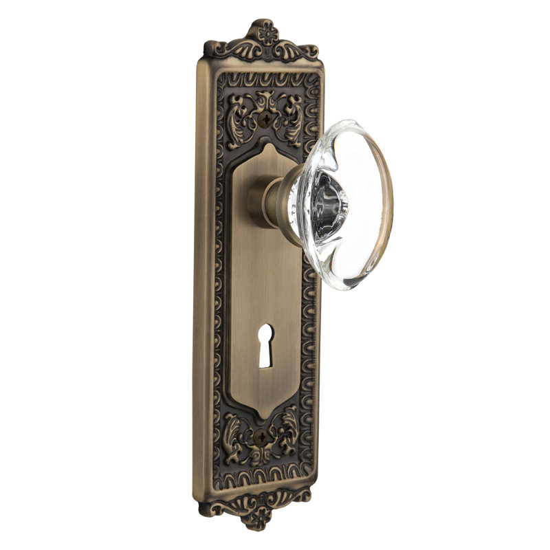 Crystal Oval Interior Mortise Door Knob with Egg & Dart Long Plate, Antique Brass