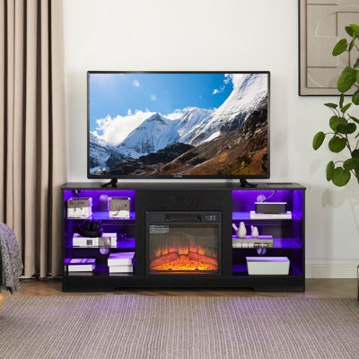 Meuble télé noir avec foyer électrique et passe-câbles, 147 cm (L) x 39 cm (P) x 62 cm (H), compatible avec les téléviseurs de 32 à 62 pouces. Ce meuble télé est doté d'un foyer, d'une simulation de flamme 3D et d'un éclairage LED. Noir, 147 cm (L).
