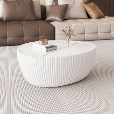 Table basse moderne moderne en forme d'œuf d'oie blanche avec plateau en pierre frittée, élégante et artistique, idéale pour le salon