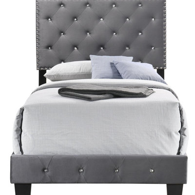 Charmant lit simple gris avec rangement