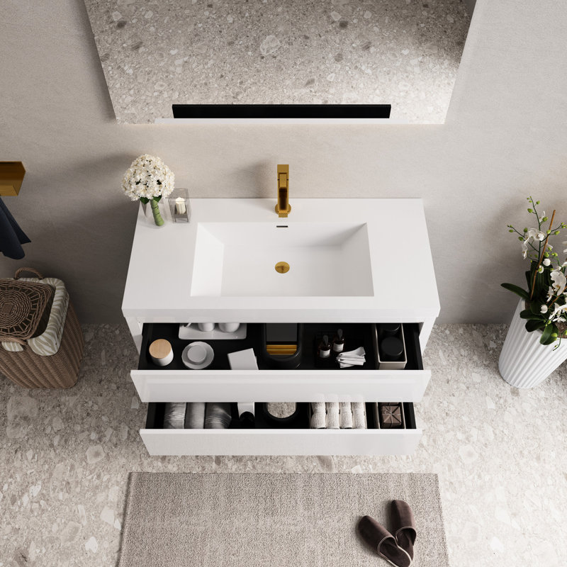 Meuble-lavabo avec rangement suspendu mural, comptoir en résine de pierre blanche brillante, tiroirs à fermeture en douceur, préassemblé pour une rénovation de rangement rapide et pratique en blanc.