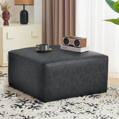 Salon carré en similicuir noir - et design élégant, fonctionnel et minimaliste