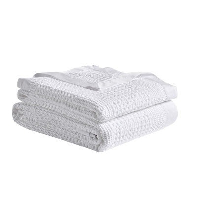 Couverture gaufrée en coton avec bordure en satin de coton
