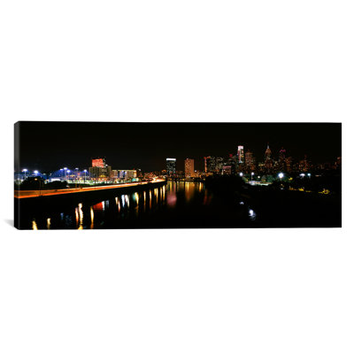 «Buildings Lit up at the Waterfront Schuylkill River, Pennsylvania», reproduction de photo sur toile