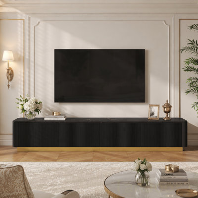 Meuble télé de luxe cannelé pour téléviseur de 85 po ou moins, console multimédia de table en faux marbre avec 4 tiroirs, profil incurvé, centre de divertissement moderne avec base dorée