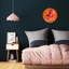 Horloge murale ronde à motif floral en acrylique sur fond orange