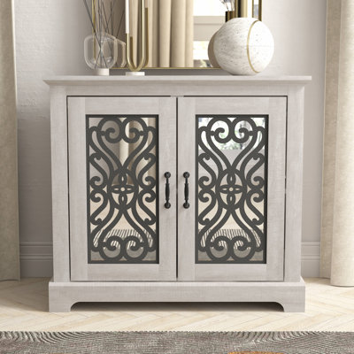 Ariba 29.3"H Traditional Decorative Cutout 2-Door Accent Cabinet