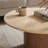 Kioni Round Travertine Coffee Table In Walnut