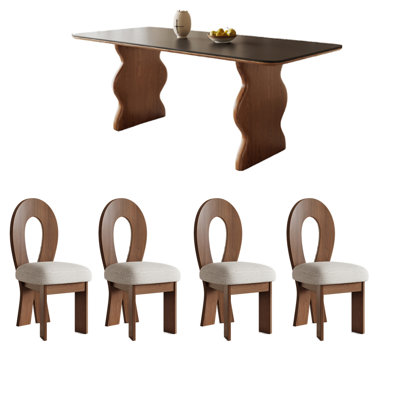 Élégants ensembles de tables de salle à manger en ardoise et en bois noirs.