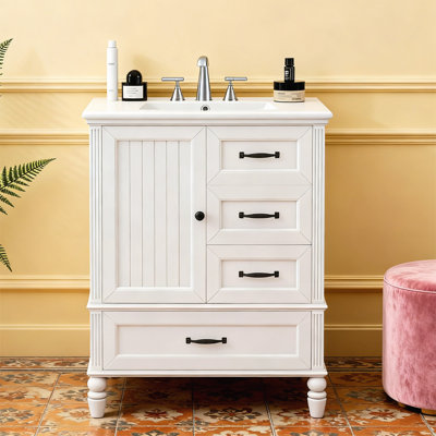 Armoire de salle de bain avec une porte et trois tiroirs