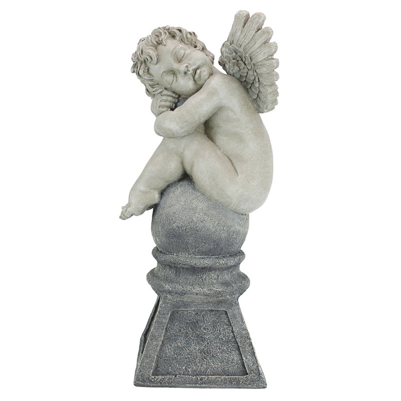 Balancing a Dream Cherub Garden Statue