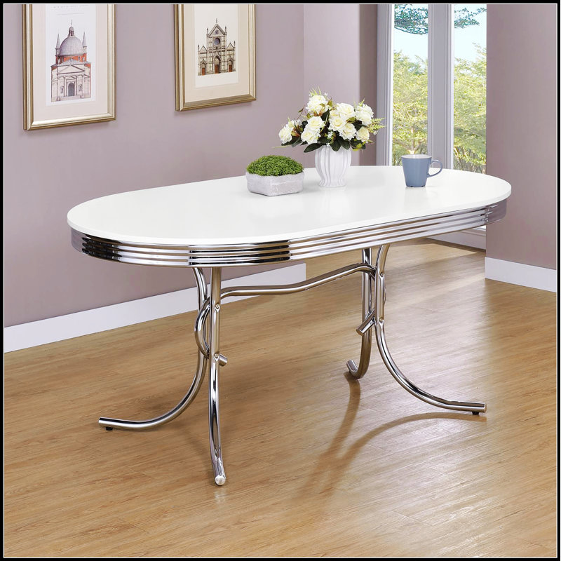 Stylish White and Chrome Oval Dining Table, Perfect for Modern Kitchens and Compact Spaces, Easy to Clean and Maintain.
