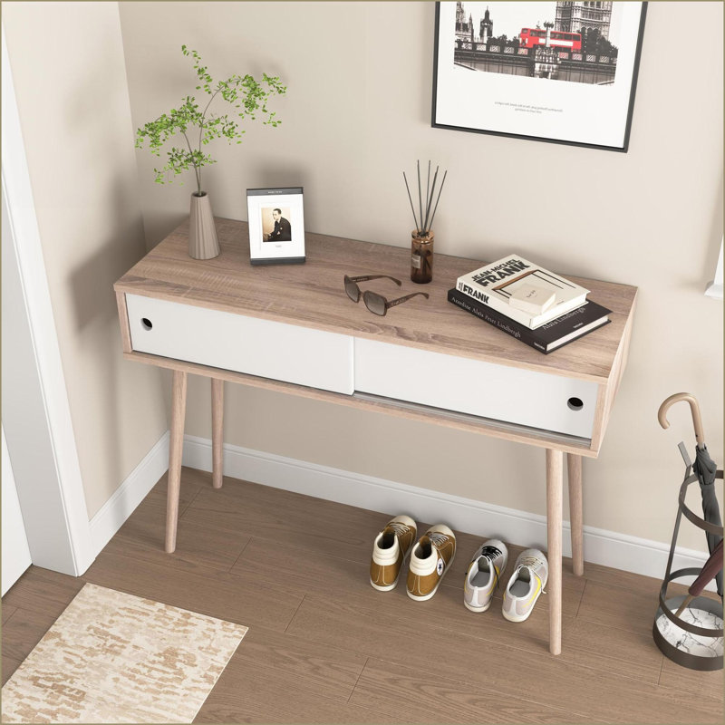 Table basse d'apparence naturelle en bois avec 2 portes coulissantes blanches, rangement peu encombrant pour le vestibule
