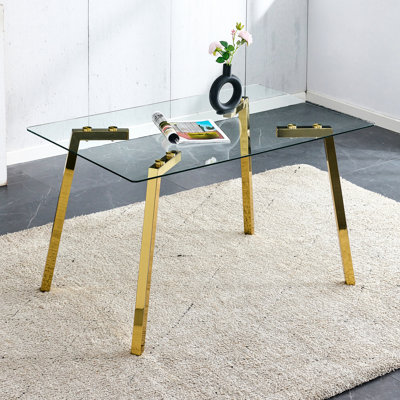 Table rectangulaire avec surface en verre trempé et pieds en métal doré, accessoire de salle à manger moderne et minimaliste