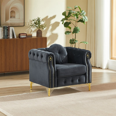 Canapé Chesterfield en velours avec coussins ronds