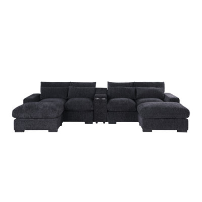 Chaise 4 places en U et rembourrée en flanelle gris foncé mi-ferme avec deux repose-pieds, porte-gobelet intégré et console avec ports de chargement, repose-pieds