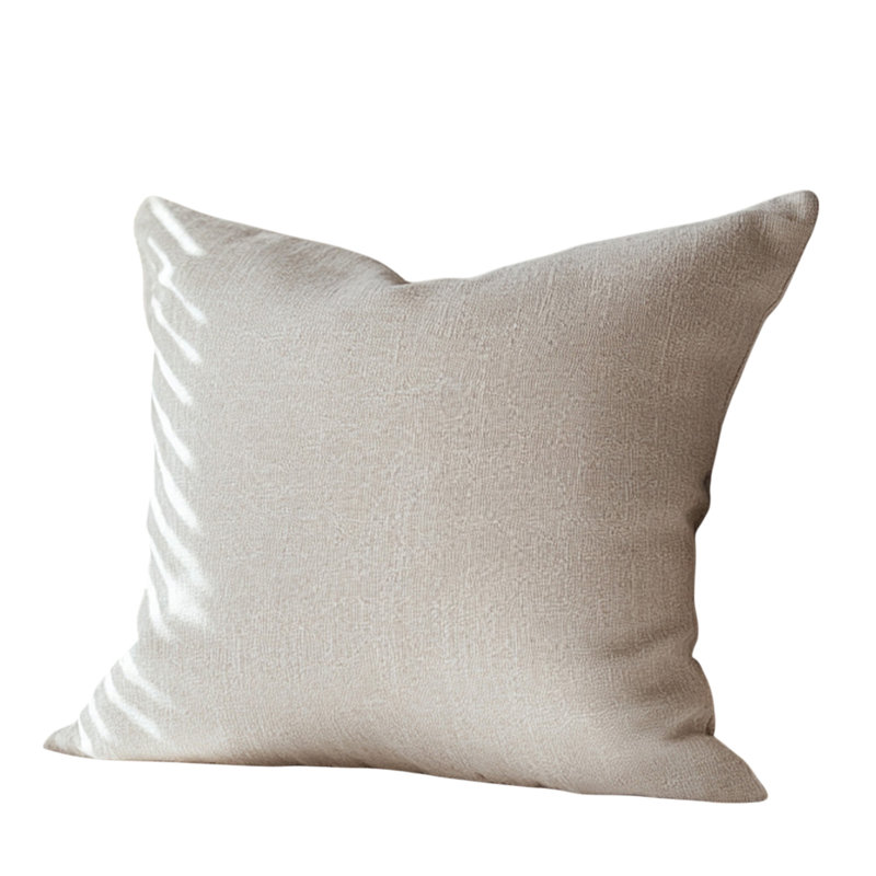 Coussin beige rayé en tricot texturé