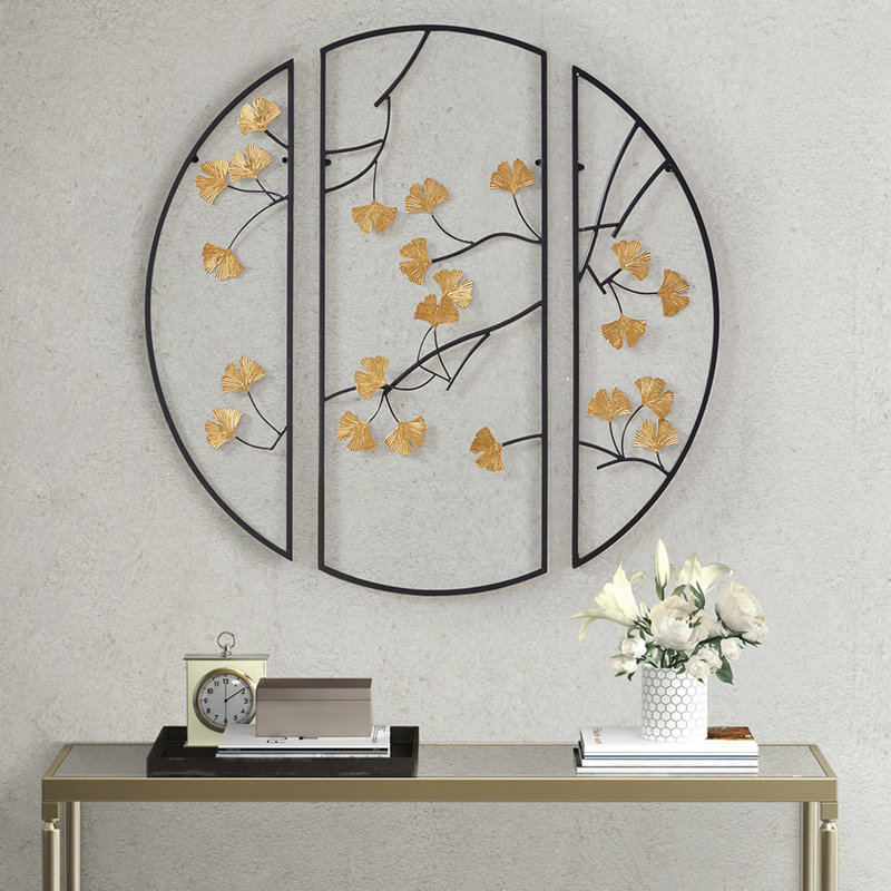 Décoration murale Hinna 3 en métal avec des feuilles de ginkgo dorées intrigantes dans une formation noire captivante