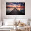 Sunset over fishing dock Aletra-107698885