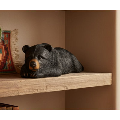 Grande sculpture en forme d'ours noir rustique