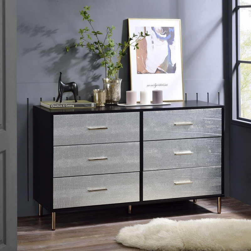 Commode noire, argentée et dorée