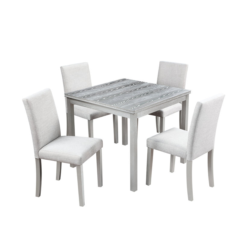 Élégante table de salle à manger gris argentée avec 5 pièces, y compris des sièges rembourrés ergonomiques et des sièges confortables en bois