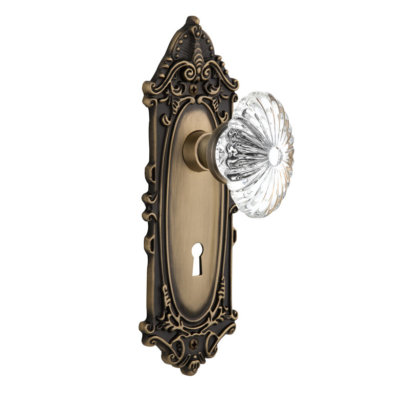 Victorian Plate with Decorative Keyhole and Oval Fluted Crystal Door Knob, Antique Brass, 2-3/4”