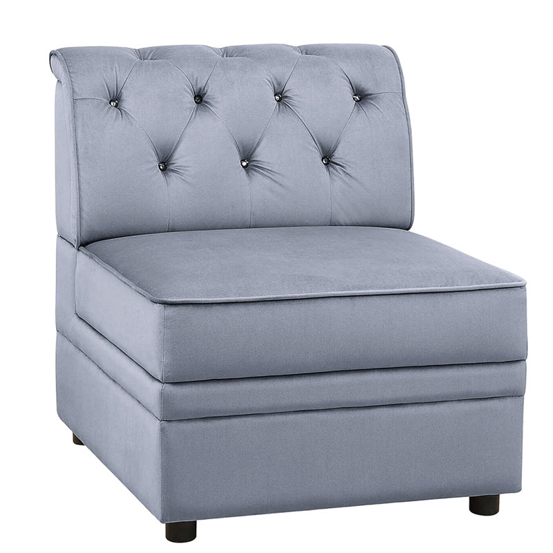 Fauteuil moderne sans accoudoirs en velours gris, orné de boutons séduisants, au charme irrésistible et au dossier captivant.