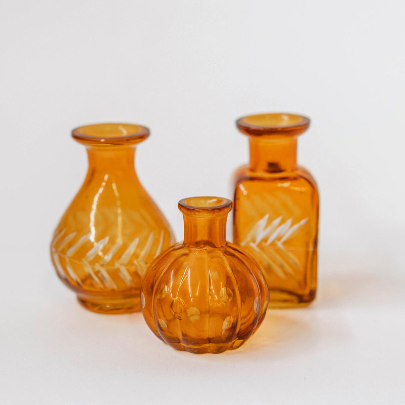Bouteille décorative carrée brun-orange avec feuilles blanches