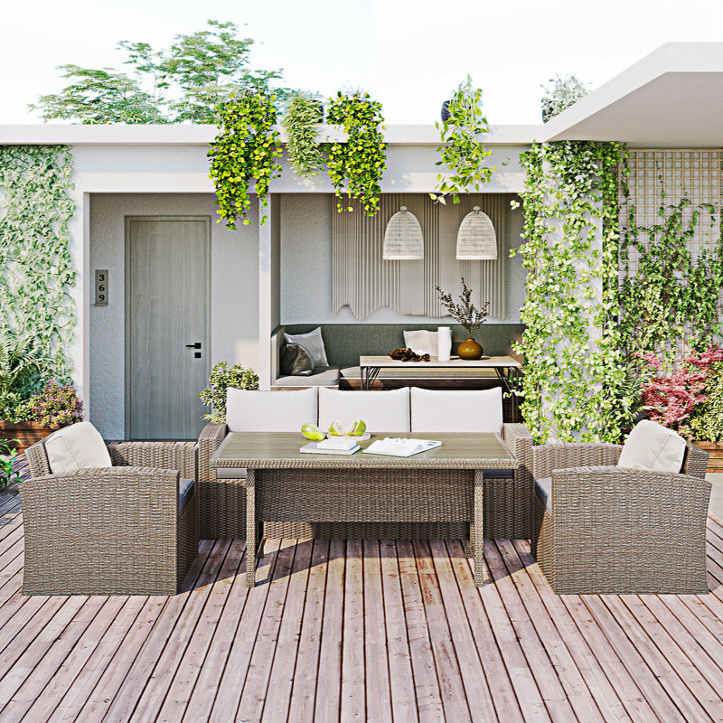 Evered 5 - Person Wicker Patio Dining Set with Rectangular Table , Cushions Included